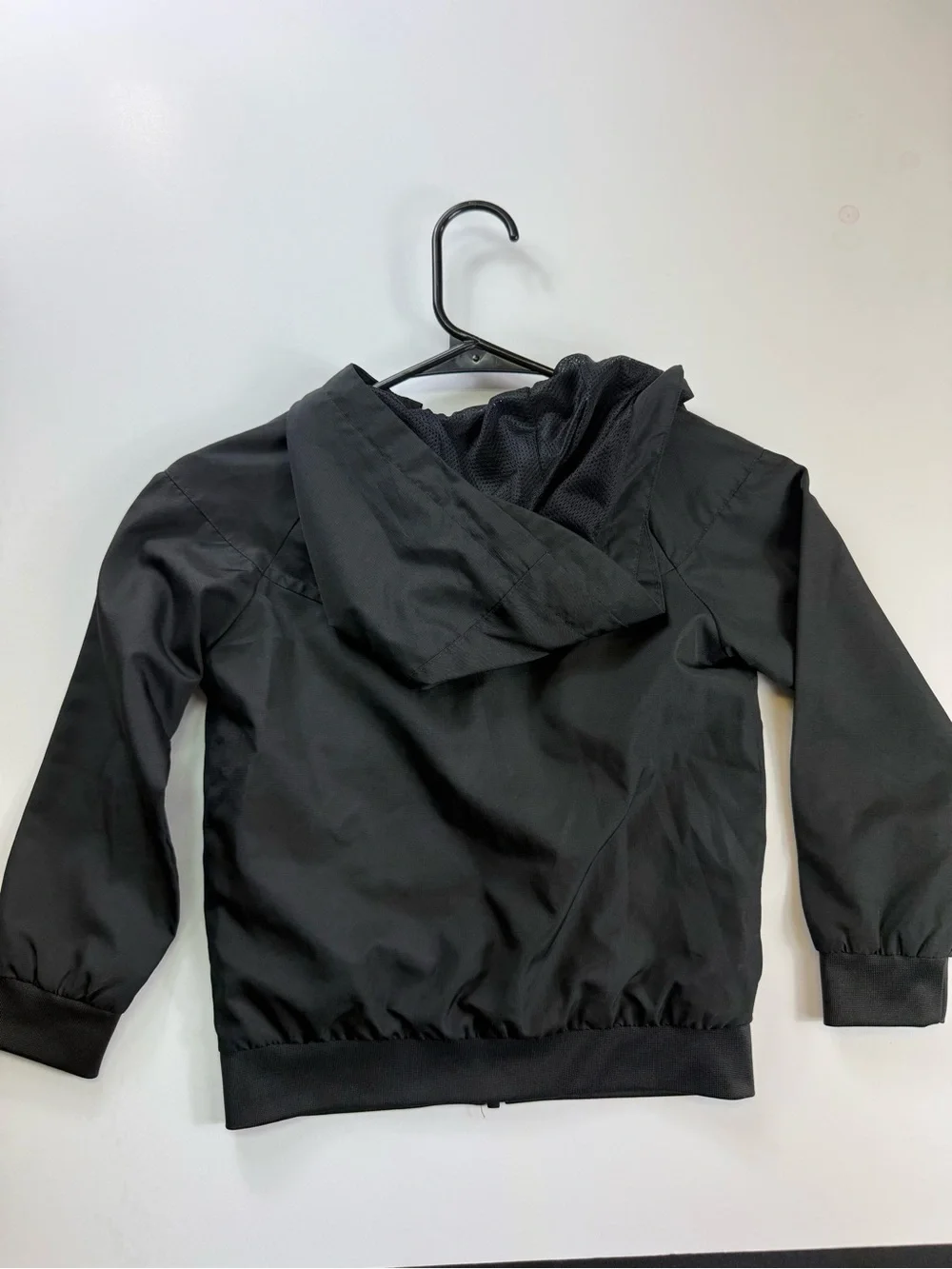 Nike Kids Black Hooded Rain Jacket with White Logo